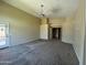 Spacious carpeted main bedroom featuring ceiling fan and closet at 2092 E Smoke Tree Rd, Gilbert, AZ 85296
