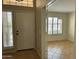 Inviting entryway showcasing neutral tones, tile flooring, and abundant natural light at 2092 E Smoke Tree Rd, Gilbert, AZ 85296