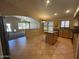 Bright and airy kitchen with island, tile floors, and seamless flow to the backyard and living area at 2092 E Smoke Tree Rd, Gilbert, AZ 85296