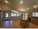 Spacious kitchen overlooking the living area and backyard, featuring an island with bar seating at 2092 E Smoke Tree Rd, Gilbert, AZ 85296