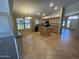 Well-lit kitchen with a center island, tile flooring, and modern appliances offering style and functionality at 2092 E Smoke Tree Rd, Gilbert, AZ 85296