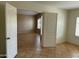 Spacious living area with tile flooring, natural light, and neutral walls at 2092 E Smoke Tree Rd, Gilbert, AZ 85296