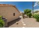 Backyard view of the hot tub, pergola, and stepping stone path leading to gravel landscape at 20961 N 96Th Dr, Peoria, AZ 85382