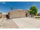 Beautiful exterior showcasing a spacious three-car garage, and well-maintained landscaping at 20961 N 96Th Dr, Peoria, AZ 85382