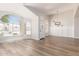 Bright, airy living room featuring hardwood floors and large windows filling the space with natural light at 20961 N 96Th Dr, Peoria, AZ 85382