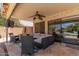 Covered back patio with comfortable seating and an outdoor ceiling fan at 2438 S Chestnut Pl, Chandler, AZ 85286