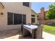 Backyard patio area features a large table for outdoor dining at 2438 S Chestnut Pl, Chandler, AZ 85286