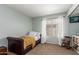 Cozy bedroom featuring carpet, a window, and simple decor at 2438 S Chestnut Pl, Chandler, AZ 85286