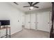 Bedroom with ceiling fan, double closets and interior bathroom entrance at 2438 S Chestnut Pl, Chandler, AZ 85286