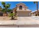 Charming two-story home with a well-manicured lawn, arched entryway, and a two-car garage at 2438 S Chestnut Pl, Chandler, AZ 85286