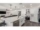 Bright, open kitchen features stainless steel appliances, white cabinetry, and a spacious center island at 2438 S Chestnut Pl, Chandler, AZ 85286