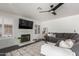 Cozy living room with a fireplace, plush seating, and a stylish rug at 2438 S Chestnut Pl, Chandler, AZ 85286