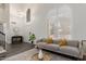 Stylish living room with high ceilings, neutral tones, and comfortable seating with large windows at 2438 S Chestnut Pl, Chandler, AZ 85286