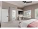 Spacious primary bedroom with ensuite bathroom, natural light, and ceiling fan at 2438 S Chestnut Pl, Chandler, AZ 85286