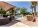 Resort-style backyard featuring a pool, patio, and outdoor kitchen at 2438 S Chestnut Pl, Chandler, AZ 85286