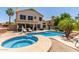 Beautiful backyard pool and spa featuring a modern design and clean lines, surrounded by a concrete deck at 2438 S Chestnut Pl, Chandler, AZ 85286