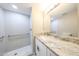 Updated bathroom showing a walk-in shower with glass door and granite vanity at 2650 W Union Hills Dr # 169, Phoenix, AZ 85027