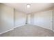 Empty bedroom featuring neutral paint and carpeting, closet door, and overhead lighting at 2650 W Union Hills Dr # 169, Phoenix, AZ 85027