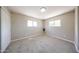 Empty bedroom showing carpeted floor and natural light from two windows at 2650 W Union Hills Dr # 169, Phoenix, AZ 85027