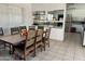 Community dining area with seating for eight and access to a modern kitchen at 2650 W Union Hills Dr # 169, Phoenix, AZ 85027