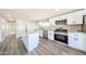 Bright kitchen featuring stainless steel appliances, island and white cabinetry at 2650 W Union Hills Dr # 169, Phoenix, AZ 85027