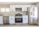 Modern kitchen featuring stainless steel appliances, granite countertops, and white cabinetry at 2650 W Union Hills Dr # 169, Phoenix, AZ 85027