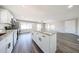 Modern kitchen island with granite countertops and white cabinetry in the open-concept living area at 2650 W Union Hills Dr # 169, Phoenix, AZ 85027