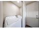 Laundry room with washer and dryer hookups, storage, and an exterior door at 2650 W Union Hills Dr # 169, Phoenix, AZ 85027