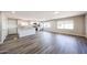 Spacious living area with modern kitchen, stainless steel appliances, and wood-look flooring at 2650 W Union Hills Dr # 169, Phoenix, AZ 85027