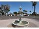 Beautiful tiered water fountain surrounded by desert landscaping, a tranquil community feature at 2650 W Union Hills Dr # 169, Phoenix, AZ 85027
