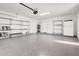 Clean and organized garage with epoxy flooring and shelving at 2801 E Sunnyside Dr, Phoenix, AZ 85028