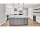 Modern kitchen featuring stainless steel appliances, a spacious island, and contemporary lighting fixtures at 2801 E Sunnyside Dr, Phoenix, AZ 85028