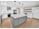 Well-equipped kitchen with modern appliances, a spacious island, and sleek cabinetry at 2801 E Sunnyside Dr, Phoenix, AZ 85028