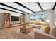 Bright living room featuring modern furniture, stylish decor, and large window views at 2801 E Sunnyside Dr, Phoenix, AZ 85028