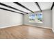 Bright living room featuring modern flooring, with a large window offering neighborhood views at 2801 E Sunnyside Dr, Phoenix, AZ 85028