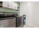 Laundry room boasts Samsung washer and dryer and storage space at 2898 E Kim Dr, San Tan Valley, AZ 85143