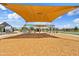 Shaded playground with swings and a soft surface for fun and safe play for of all ages at 2898 E Kim Dr, San Tan Valley, AZ 85143