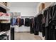 Walk-in closet featuring organized shelving and hanging rods for ample storage space and organization solutions at 2898 E Kim Dr, San Tan Valley, AZ 85143