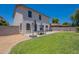 Backyard showcasing a well-maintained lawn, outdoor seating area and lots of room to enjoy at 3047 S Mandy St, Mesa, AZ 85212