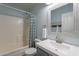 Bright bathroom featuring a shower-tub combo, vanity sink, and decorative mirror with a towel rack at 3047 S Mandy St, Mesa, AZ 85212
