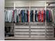 Walk-in closet with custom shelving, multiple hanging rods, and drawer storage for optimal organization at 3047 S Mandy St, Mesa, AZ 85212