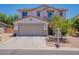 Charming two-story home featuring a spacious two-car garage and a well-maintained front yard at 3047 S Mandy St, Mesa, AZ 85212
