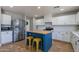 Modern kitchen featuring stainless steel appliances, a butcher block island, and white cabinetry at 3047 S Mandy St, Mesa, AZ 85212