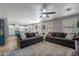 Open-concept living room with a view into the bright, modern kitchen and dining area at 3047 S Mandy St, Mesa, AZ 85212