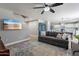Open living room with a ceiling fan and views of the adjacent kitchen at 3047 S Mandy St, Mesa, AZ 85212