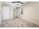 Bright bedroom with carpet, a ceiling fan and a mirrored sliding closet and blinds at 3324 S Parkside Dr, Tempe, AZ 85282