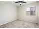 Bright bedroom with neutral paint, carpet, a ceiling fan and a window with blinds at 3324 S Parkside Dr, Tempe, AZ 85282