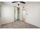 Bright bedroom with carpet, a ceiling fan and a mirrored sliding closet with an open entry at 3324 S Parkside Dr, Tempe, AZ 85282