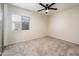 Bright bedroom with neutral paint, carpet, a ceiling fan and a window with blinds at 3324 S Parkside Dr, Tempe, AZ 85282