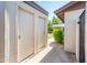 Exterior view highlighting storage area with doors, a gated entrance, and some greenery adding charm at 3324 S Parkside Dr, Tempe, AZ 85282